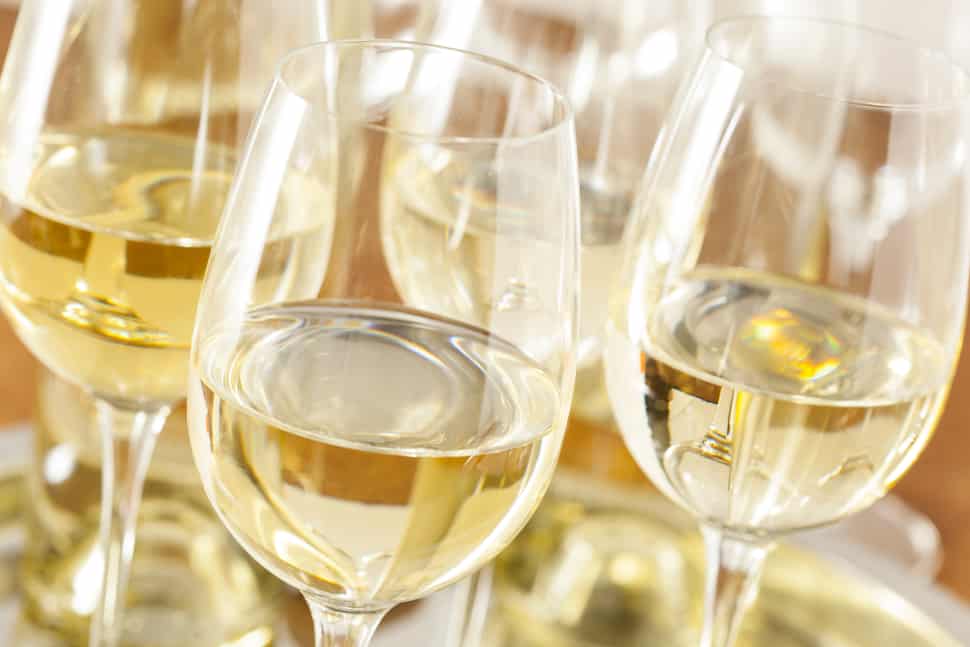 Chardonnay wine glasses glimmering in the sunlight reveals the tr color of the varietal.