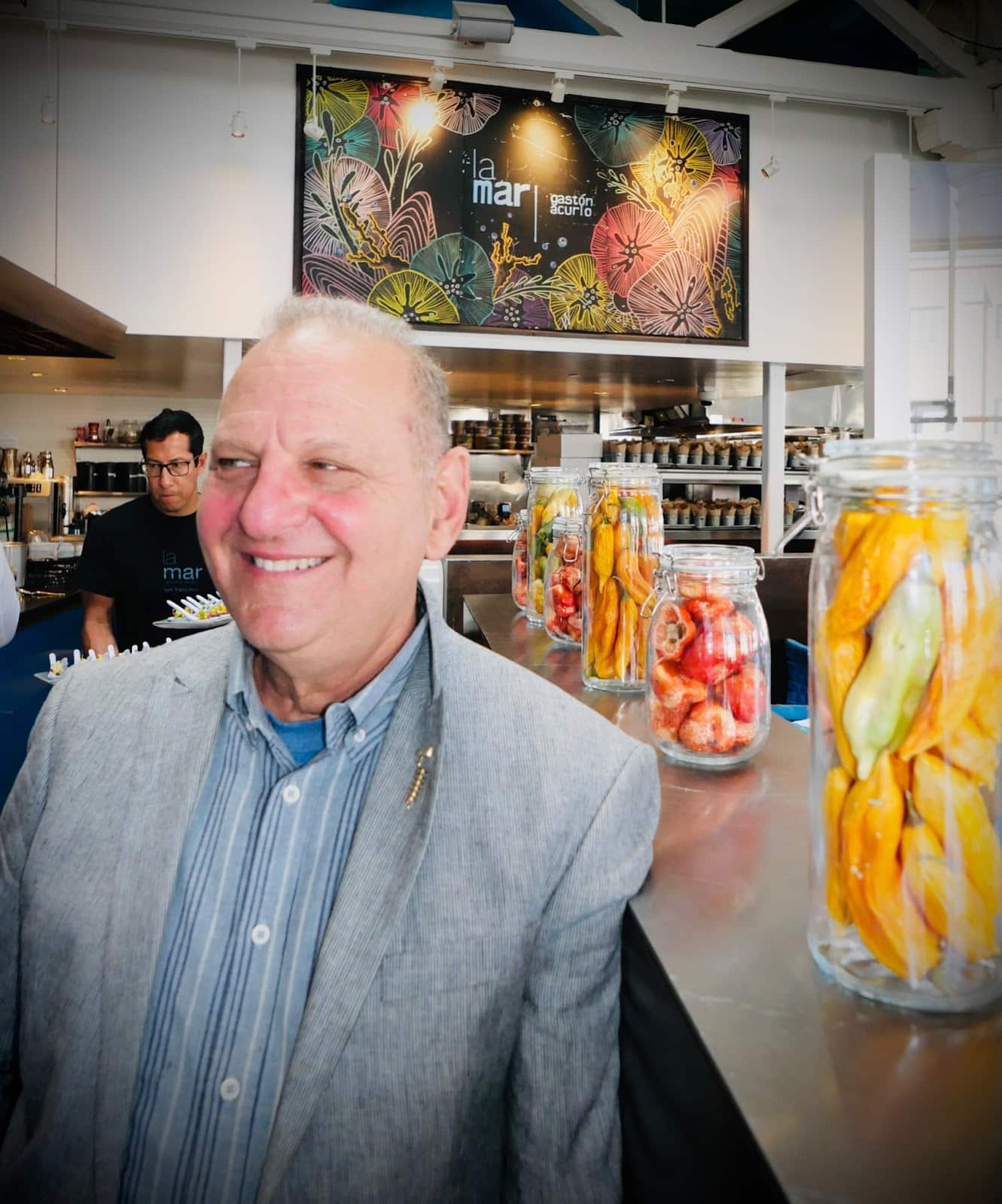 Sebastopol Winery Owner Ross Halleck adorned by Peruvian peppers reminiscent of Matisse’s Goldfish.