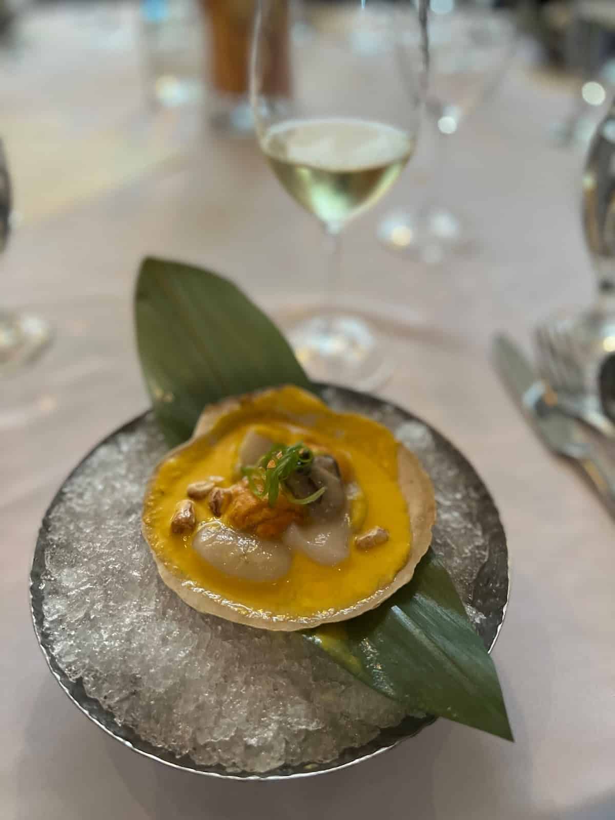 Live Maine Scallops, Santa Barbara sea urchin and a Kumamoto oyster with Amarillo sauce.