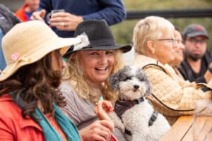 A group of girlfriends enjoying Russian River Valley Sauvignon Blanc at Halleck Vineyard winery in Sonoma, along with their cute little doggy who is a member of the Halleck Vineyard dog club. The women take in the beautiful views of the earth and savor the delicious taste of seafood paired perfectly with the Sauvignon Blanc. They also learned about the art of winemaking from the expert winemakers at Halleck Vineyard while enjoying artisanal cheese and participating in an auction to benefit the local community.