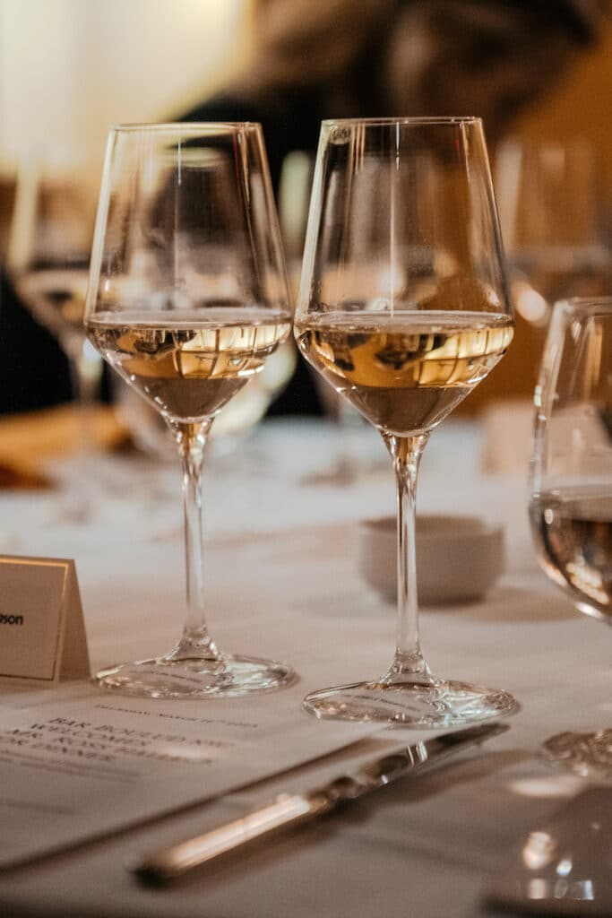 Two glasses of premium Russian River Valley Sauvignon Blanc sit elegantly on the table at Bar Boulud, the Michelin star French bistro in New York City. The wine, crafted by Halleck Vineyard, is known for its crisp acidity, bright flavors, and distinct minerality. Its unique terroir, with its cool climate and diverse soils, produces some of the finest Sauvignon Blanc in the world. The wine's exceptional quality and taste make it a favorite among wine enthusiasts, and its pairing with the delectable menu at Bar Boulud creates a truly memorable dining experience.